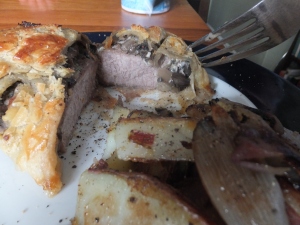 This is actually a photo of the Beef Wellington from the next day - I re-heated it and therefore sacrificed some tender rarity! Nonetheless still delicious with a shallot mushroom chives and cheese layer between the top and the pastry. 