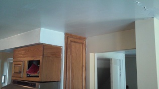 note the missing door on the oak cabinet. You will see that there is a brick chimney behind this.